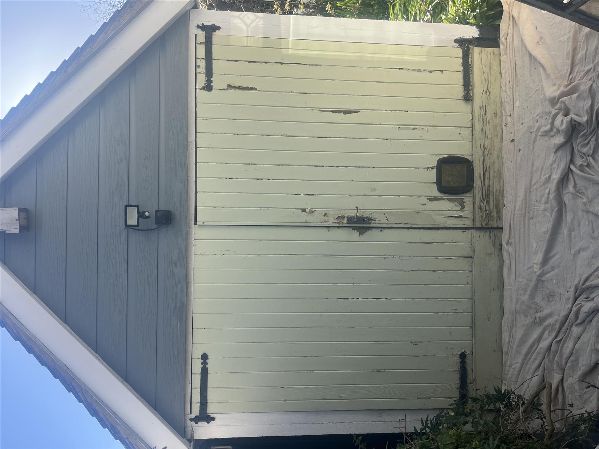 Before, garage door with peeling paint, Essex